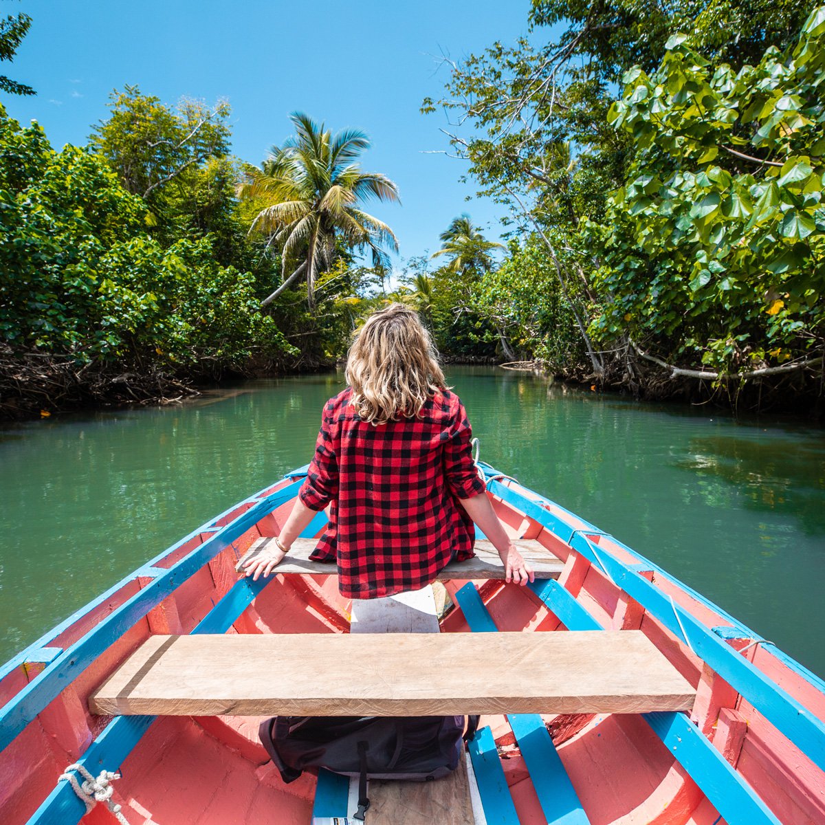 Girl traveling by boat on a river